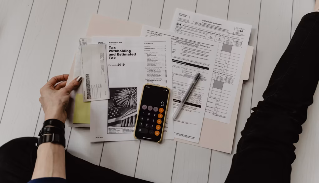 "Investor reviewing wash sale rule checklist for crypto and tech stocks with calculator and documents"